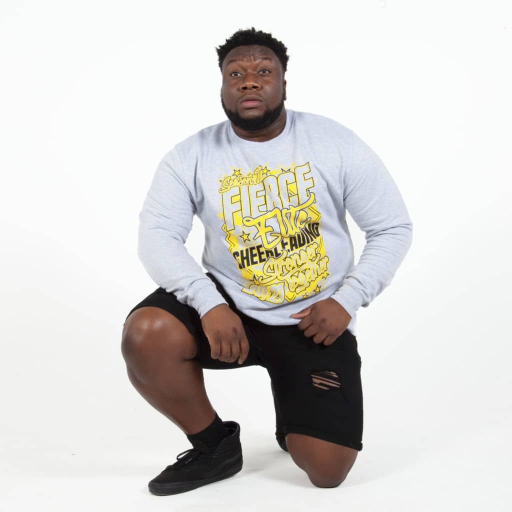 Idrottare i grå tröja